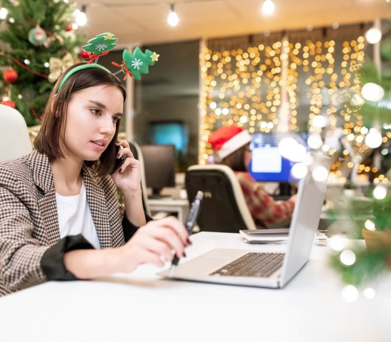 young-contemporary-businesswoman-with-mobile-phone-organizing-work-in-office.jpg